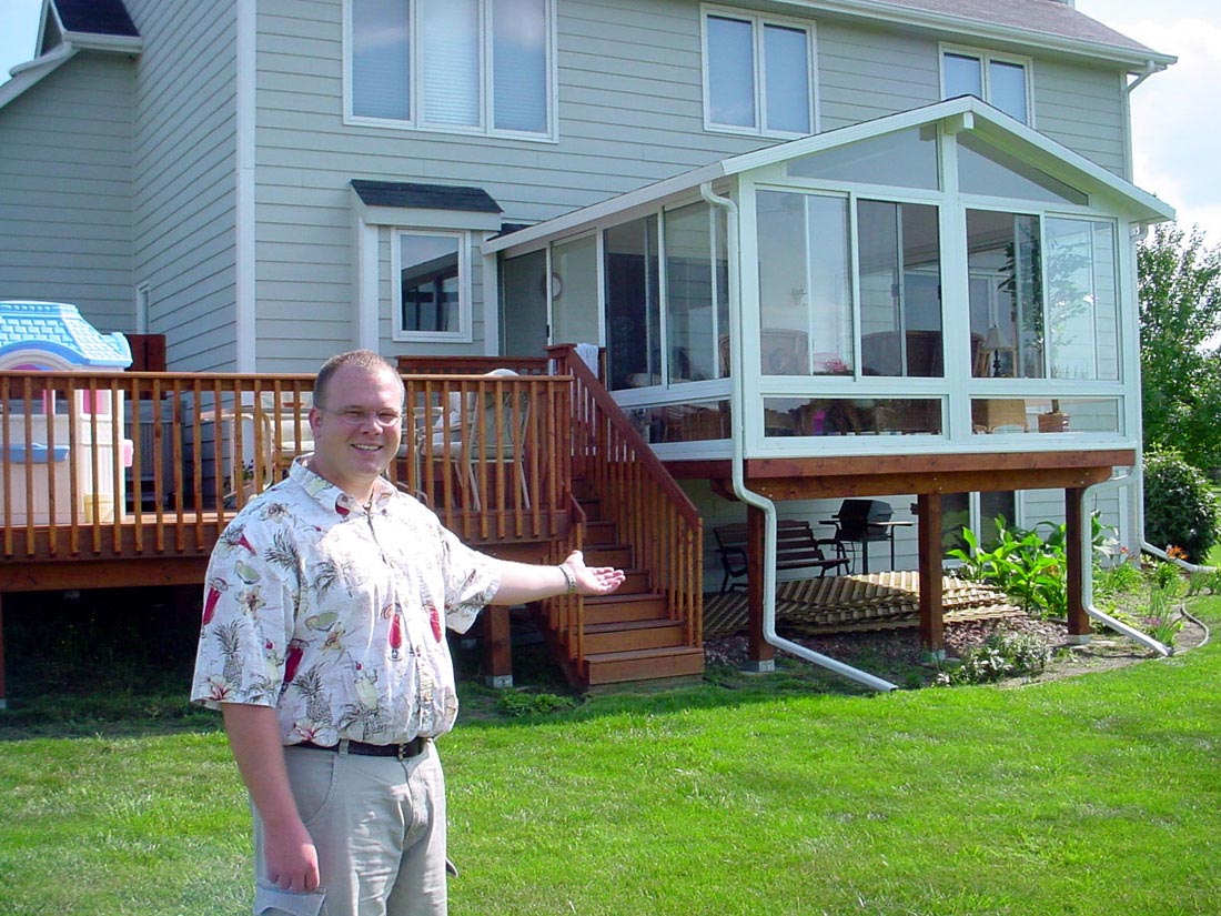 man standing by sunroom